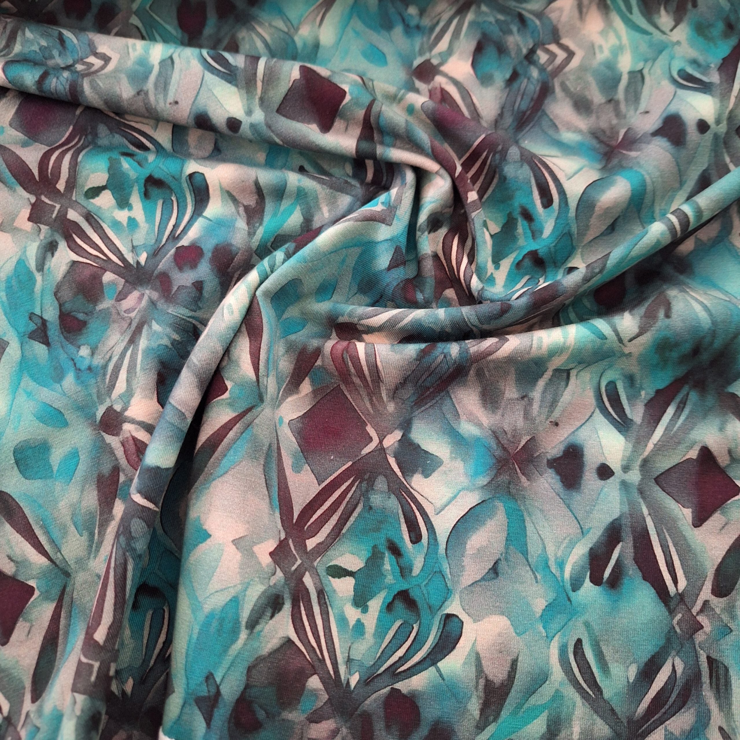 Baumwolljersey dunkeltürkis mit abstraktem Muster