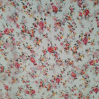 Viskose weiß mit kleinen rosa Blüten (sehr transparent)