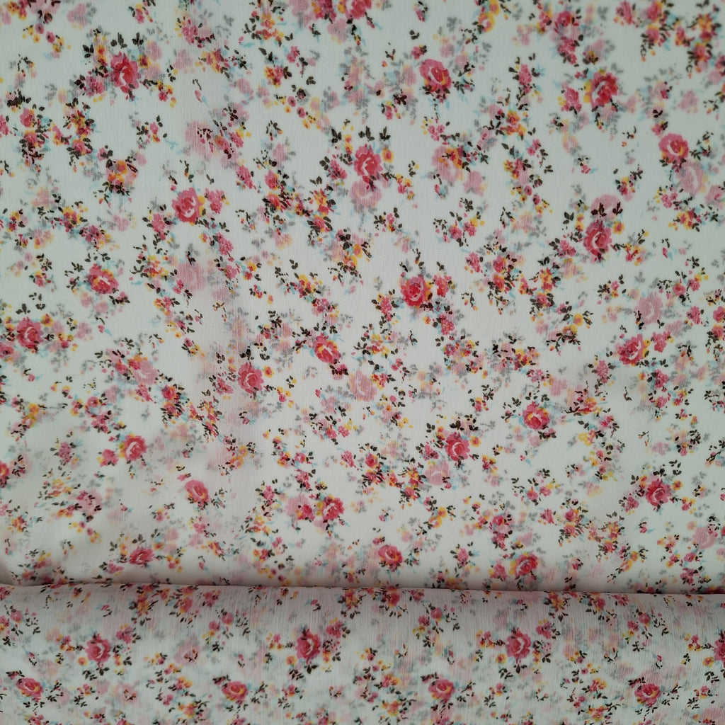 Viskose weiß mit kleinen rosa Blüten (sehr transparent)