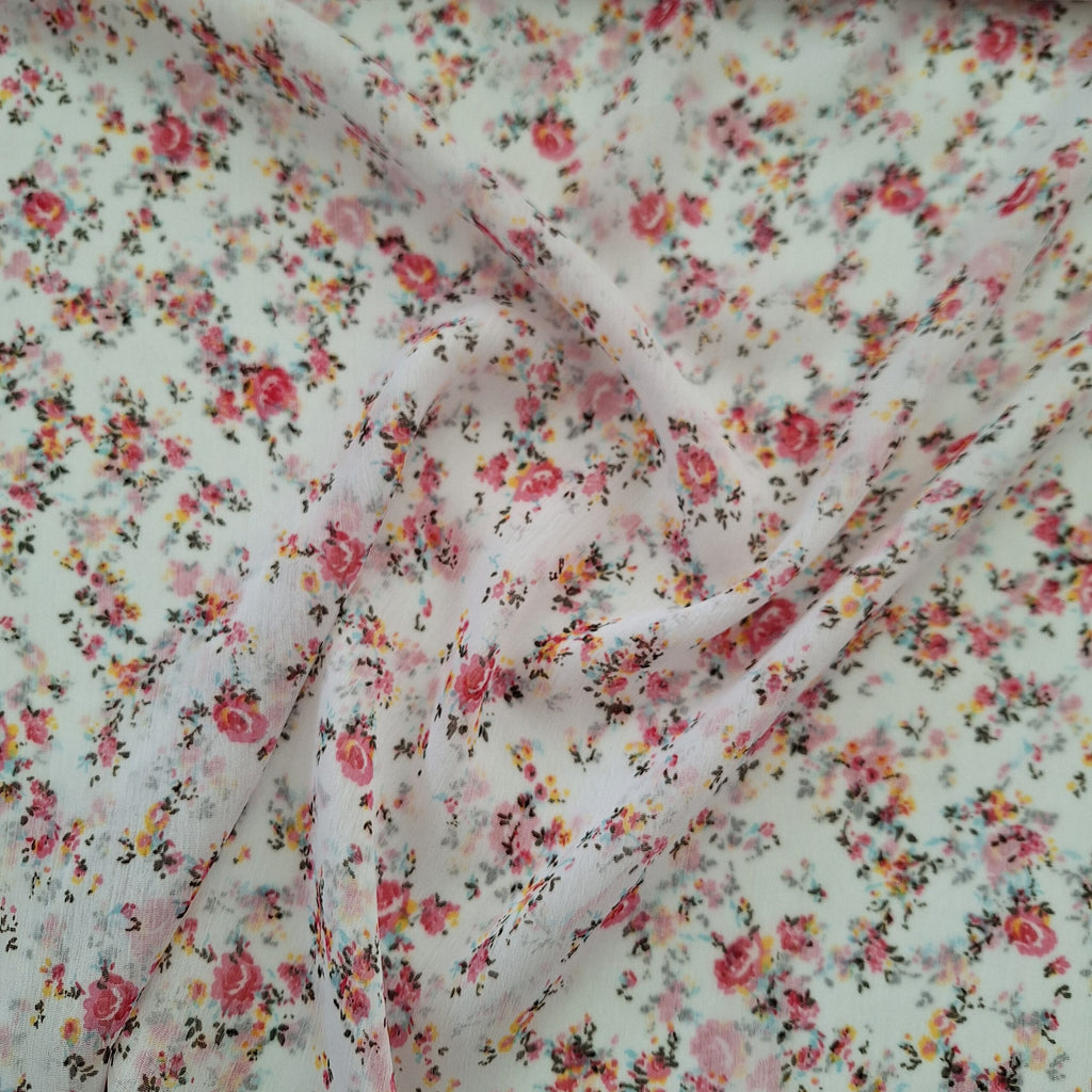 Viskose weiß mit kleinen rosa Blüten (sehr transparent)