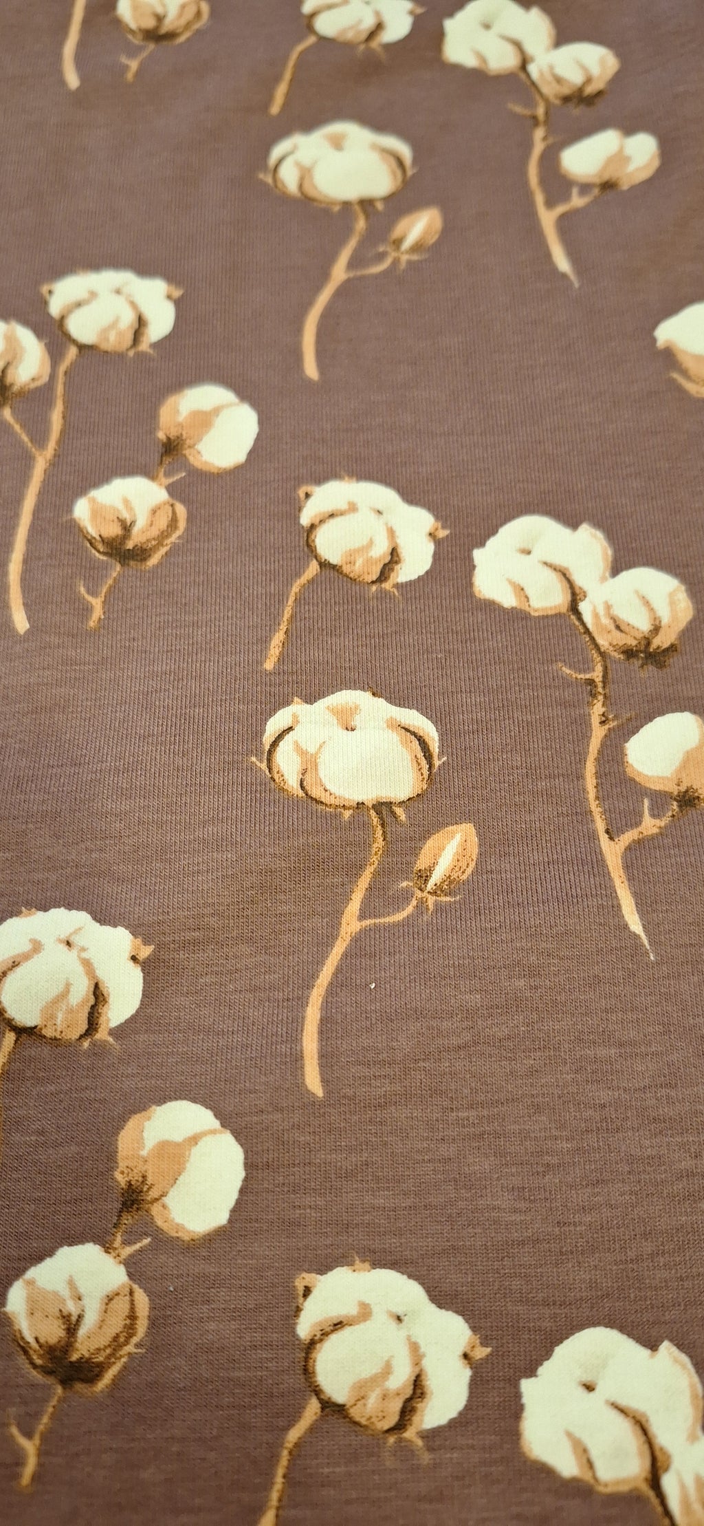 Baumwolljersey mauve mit Baumwollblüten