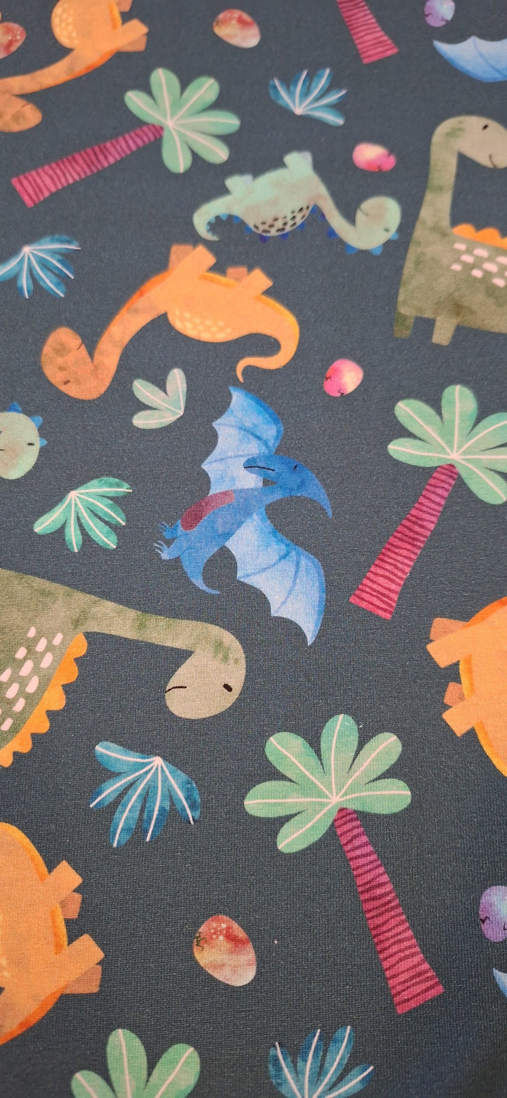 Baumwolljersey grün mit Dinosauriern