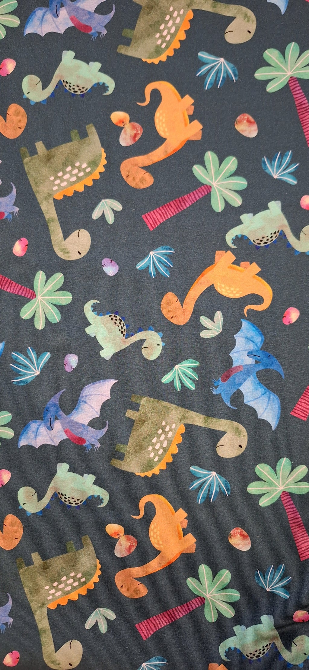 Baumwolljersey grün mit Dinosauriern