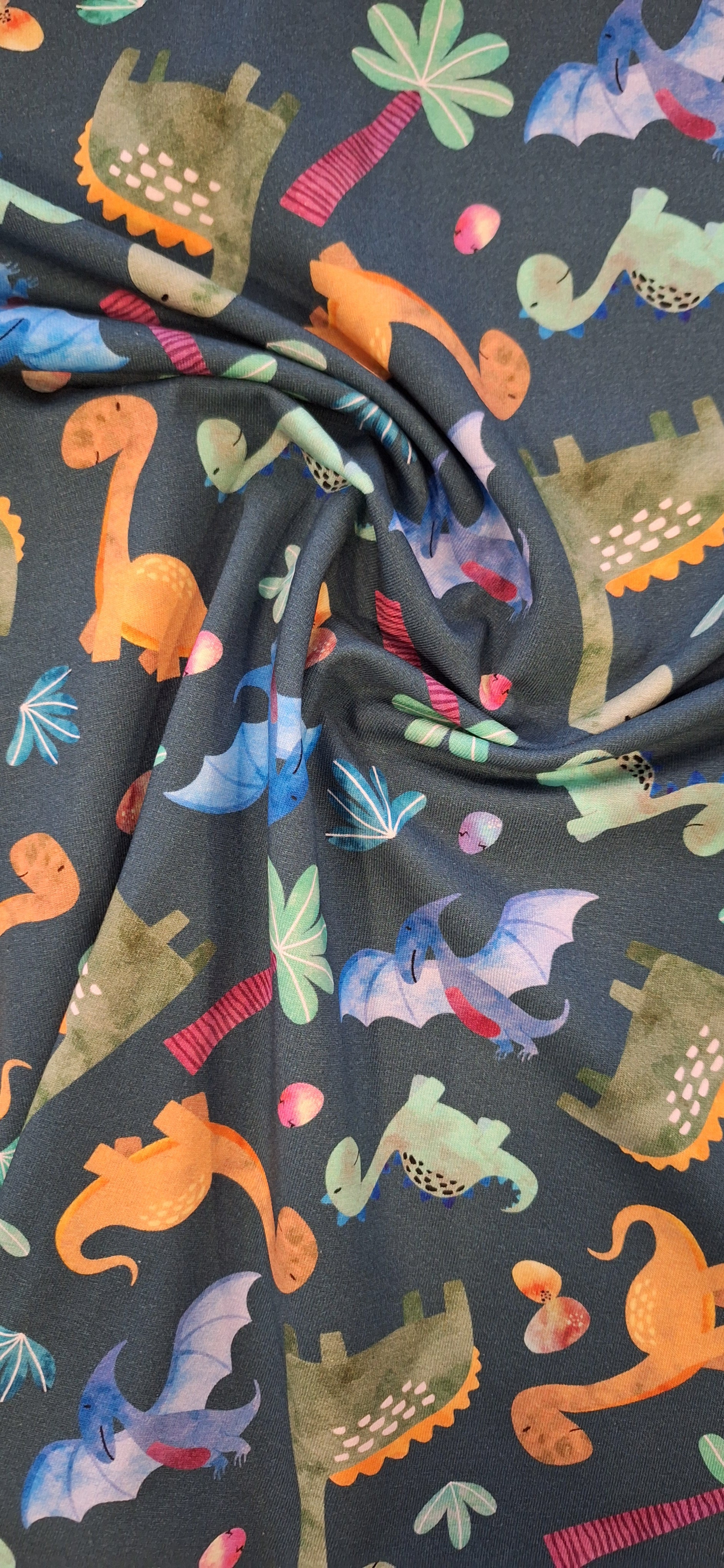 Baumwolljersey grün mit Dinosauriern