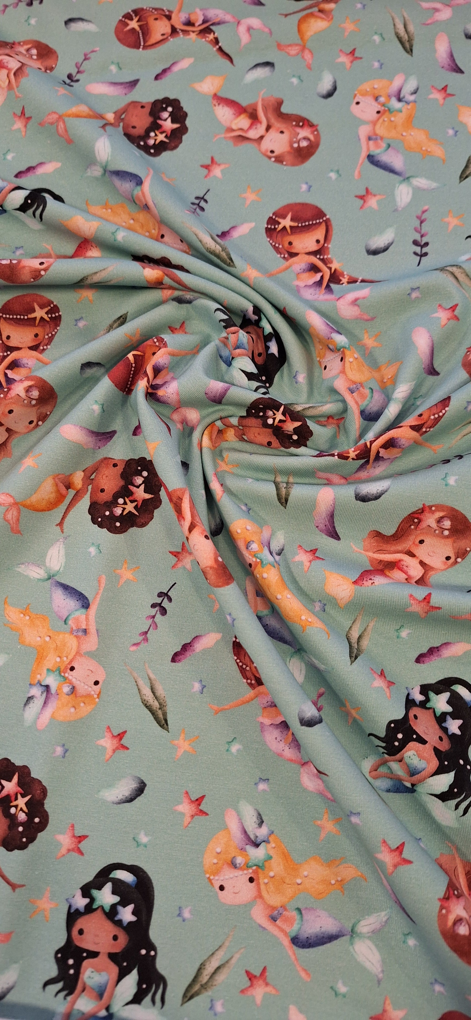 Baumwolljersey türkis mit Meerjungfrauen