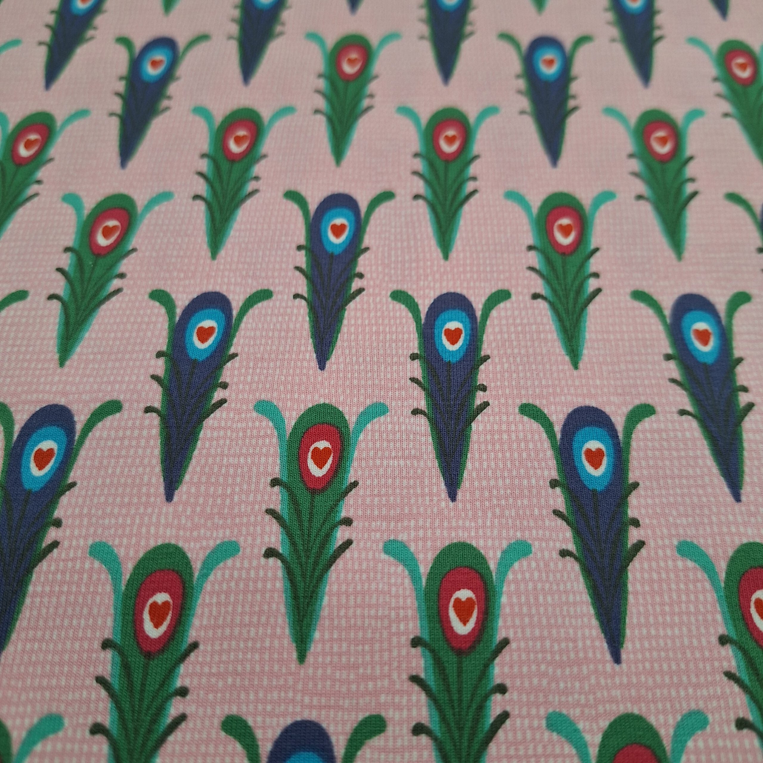 Baumwolljersey rosa mit abstrakten Motiven