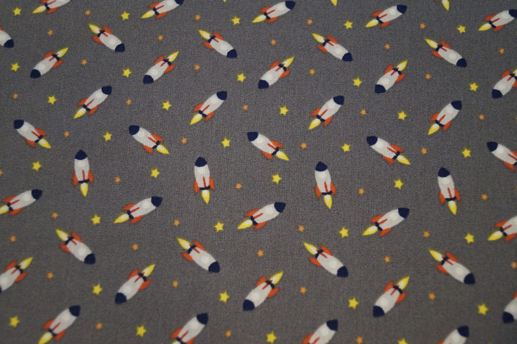 Popeline grau mit Raketen