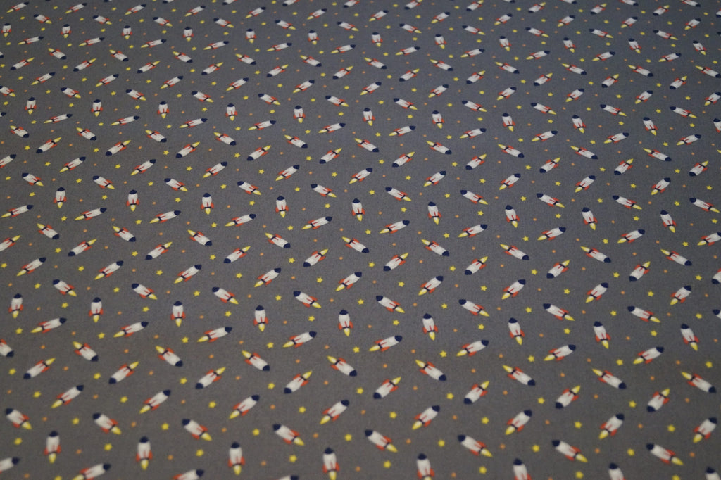 Popeline grau mit Raketen