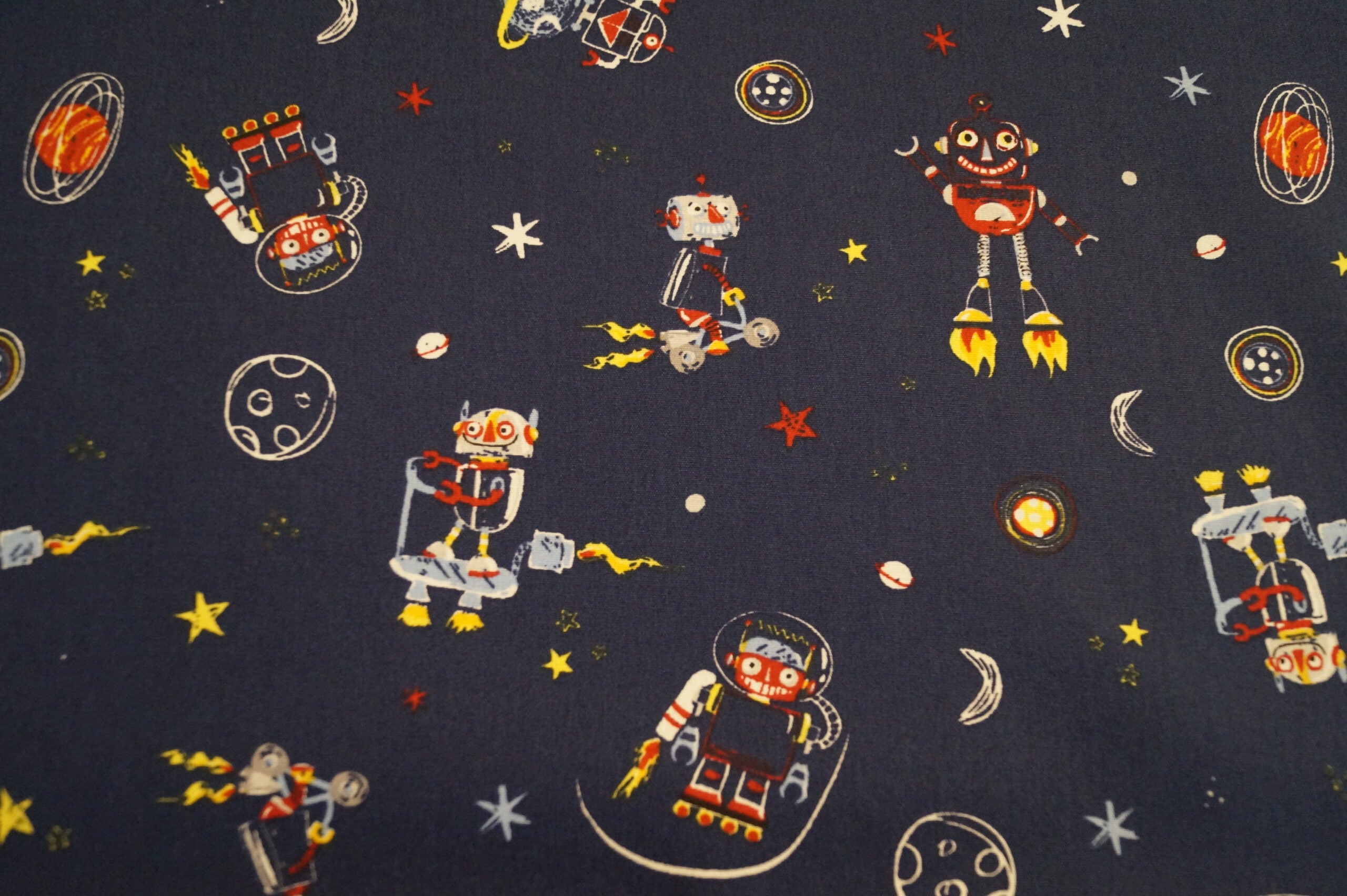 Popeline dunkelblau mit Weltallmotiven