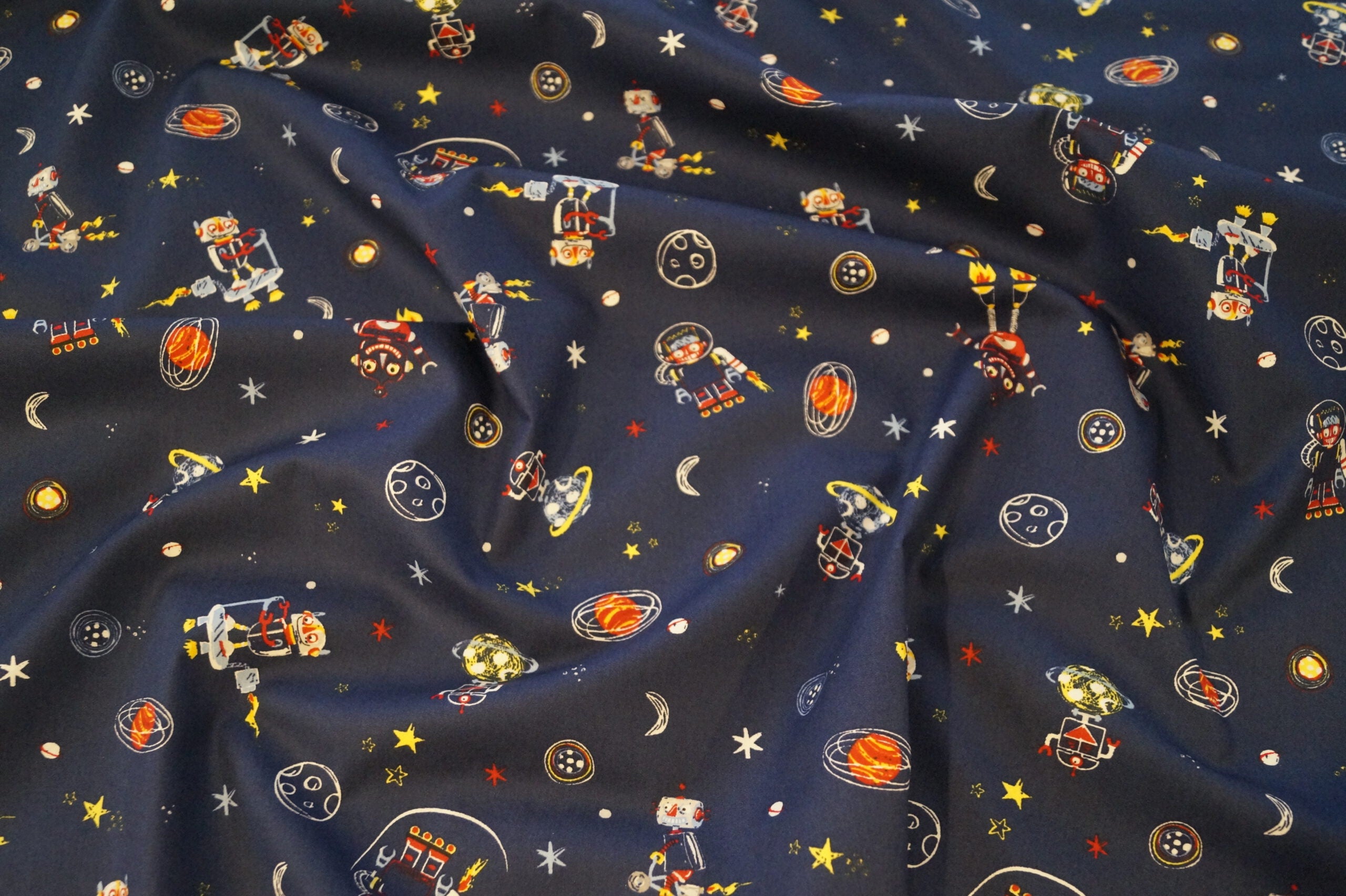 Popeline dunkelblau mit Weltallmotiven