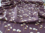 Baumwolljersey mauve mit Baumwollblüten