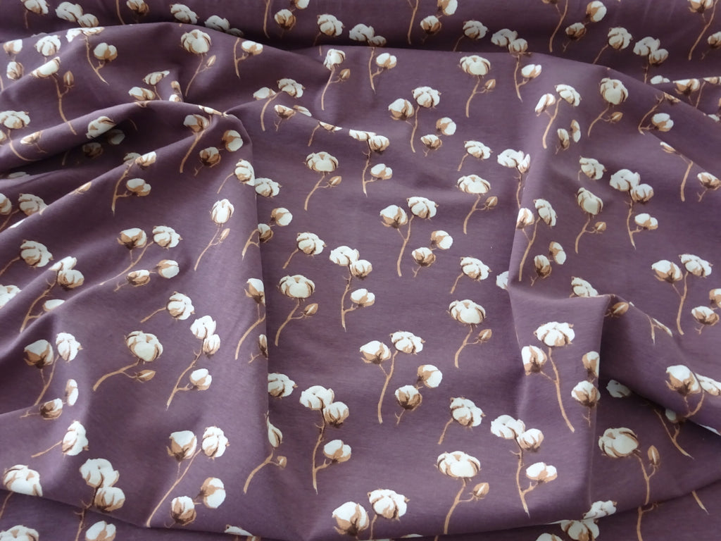 Baumwolljersey mauve mit Baumwollblüten