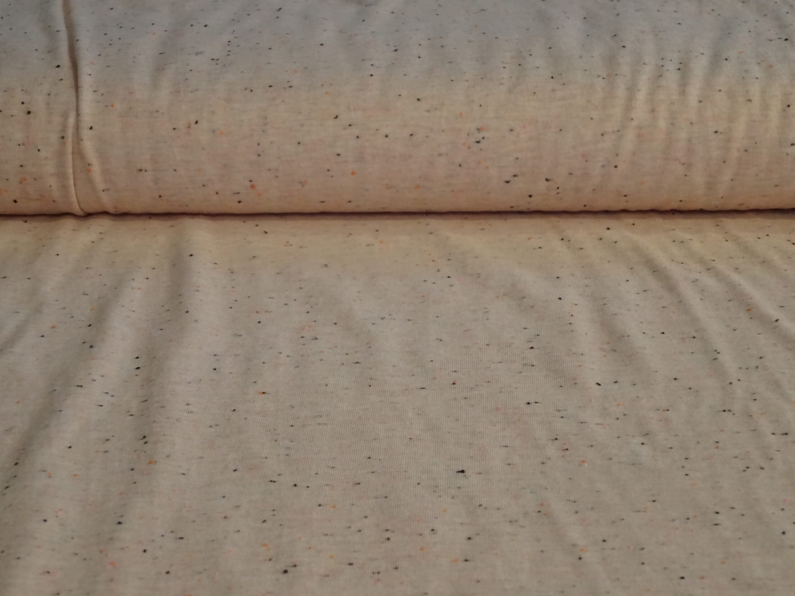 Baumwolljersey aprikotfarben beflockt