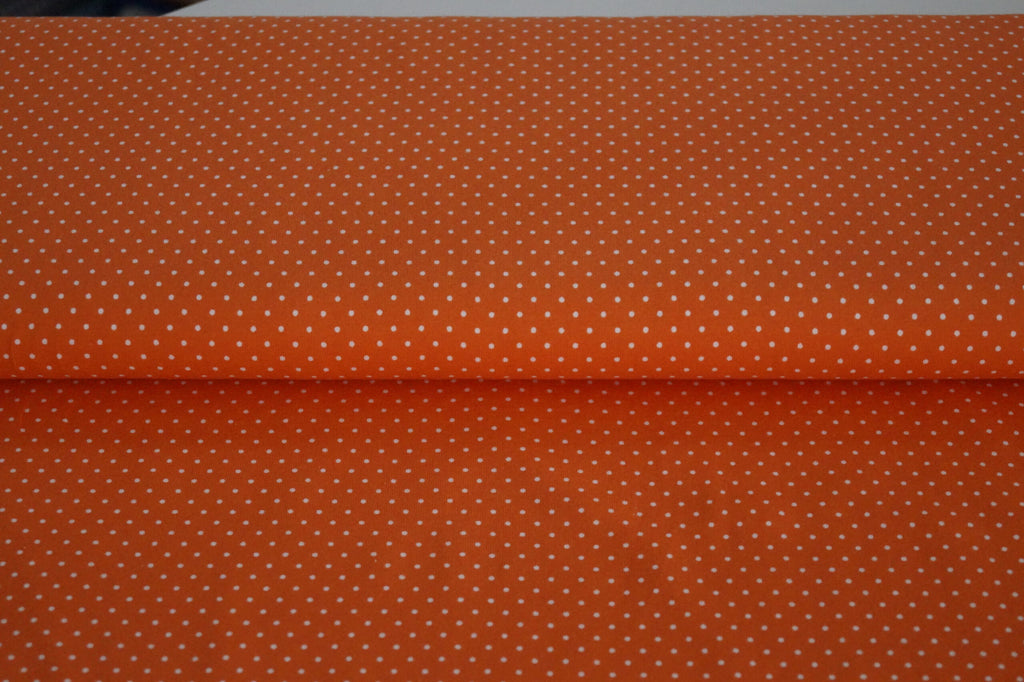 Baumwolljersey orange mit weißen Punkten