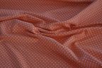 Baumwolljersey orange mit weißen Punkten