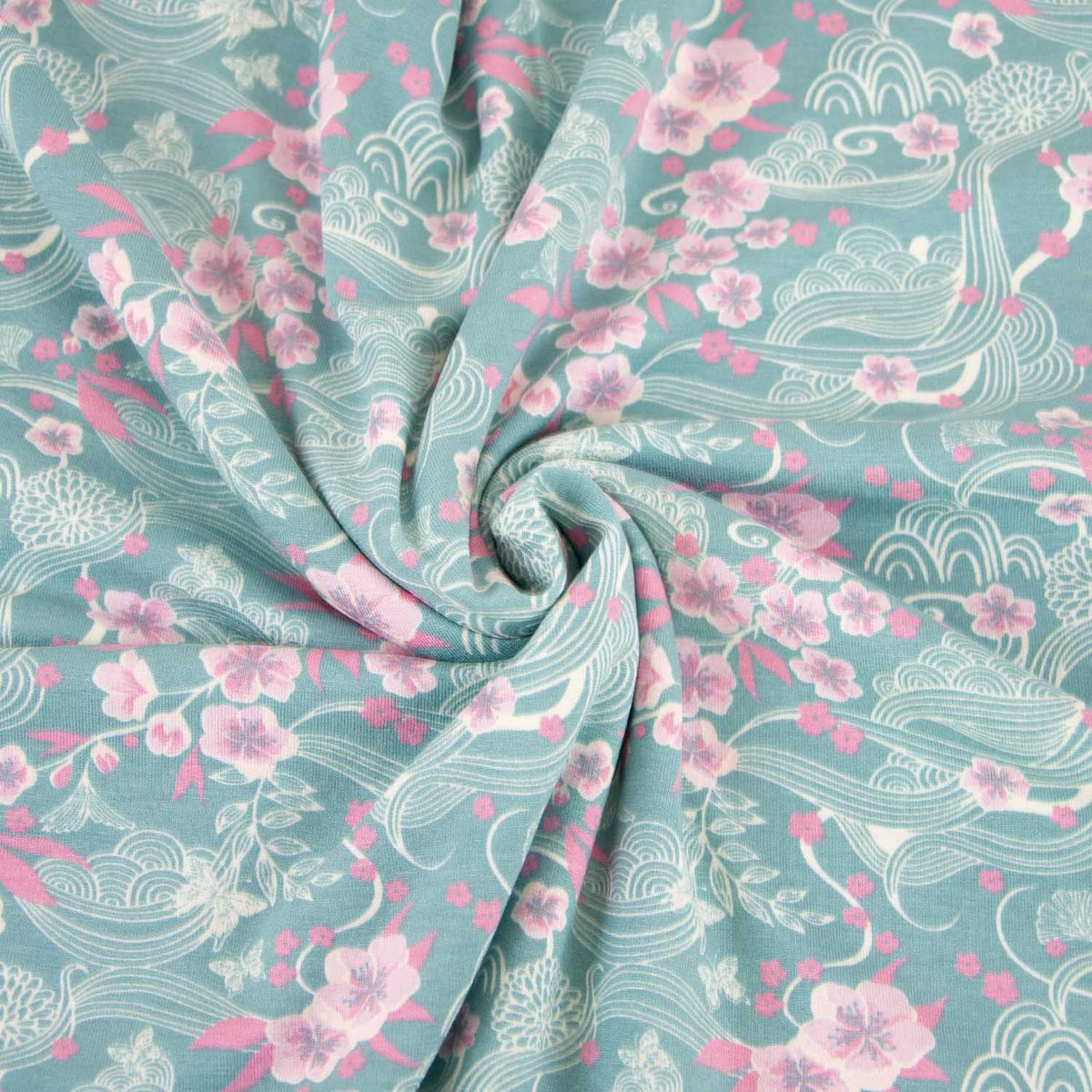 Viskosejersey türkis mit rosa Kirschblüten